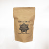 Terra Nova's sample packs come in sealed kraft bags with a one-way valve and resealable closure. The one-way valve allows gas to escape without letting oxygen in, keeping the coffee super-fresh when sealed properly. Each bag is hand-stamped and labeled.
